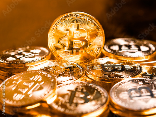 Stack of golden bitcoins. Business golden background concept with bitcoin criptocurrency