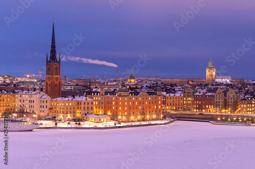 Snow on old building in winter Stockholm on sunset