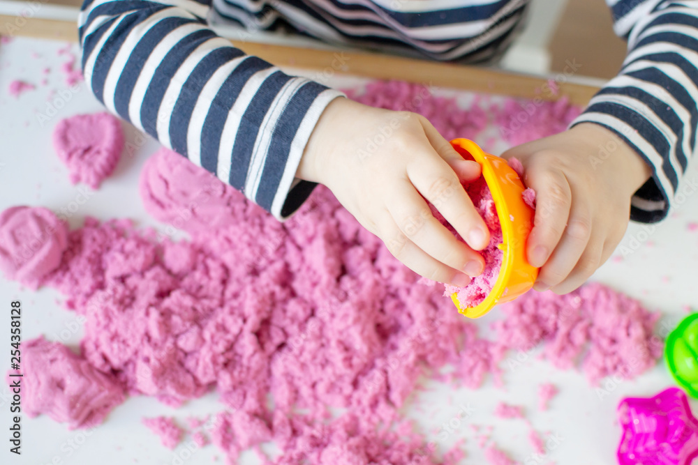 Little Happy Caucasian Girl Playing with Pink Kinetic Sand at Home Early Education Preparing for School Development Children Game Little Happy Caucasian Girl Playing with Pink Kinetic Sand at Home Early Education Preparing for School Development Children Game