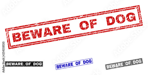 Grunge BEWARE OF DOG rectangle stamp seals isolated on a white background. Rectangular seals with grunge texture in red, blue, black and gray colors.