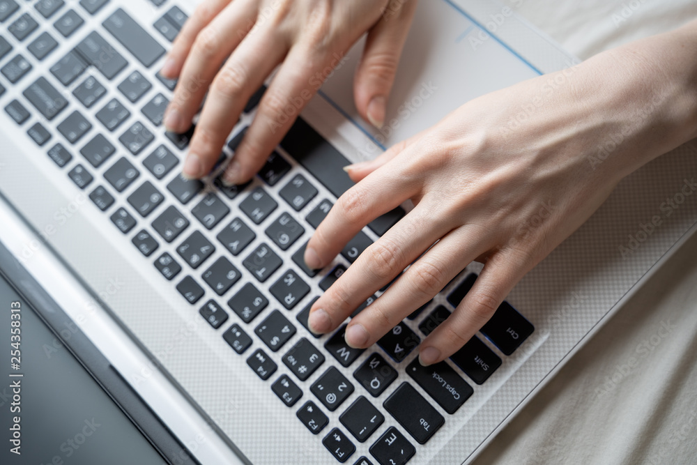 business, education, programming, people and technology concept - close up of female hands typing on keyboard