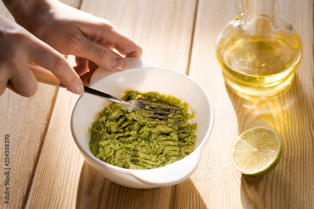 Guacamole freshly cooked and served in a bowl Guacamole freshly cooked and served in a bowl