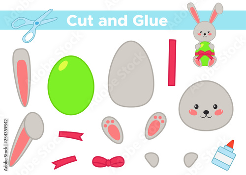 Education paper game for preschool kids. Create the applique cute Easter rabbit with egg. Cut and glue. Vector illustration.