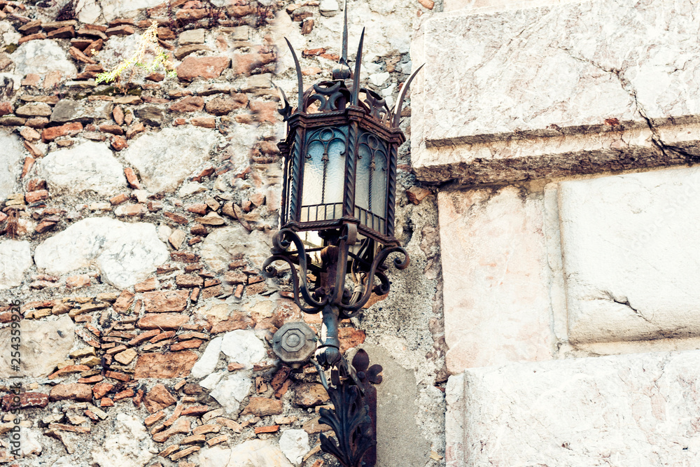 Old street lamppost – vintage light on streets in Taormina, Sicily, Italy.