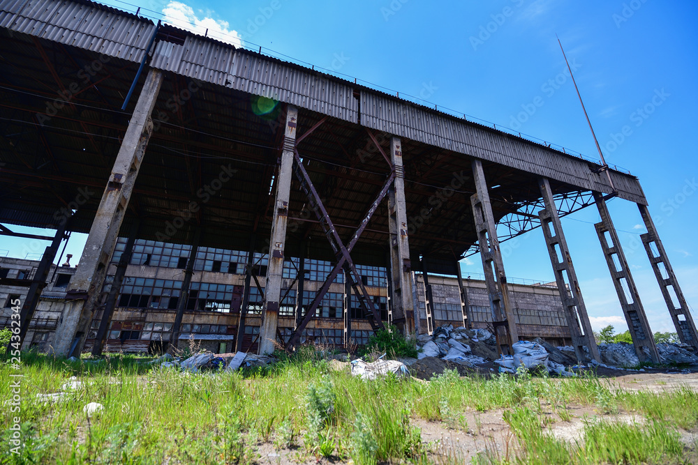 View of an abandoned factory, warehouse in an industrial area. Horizontal photography View of an abandoned factory, warehouse in an industrial area. Horizontal photography