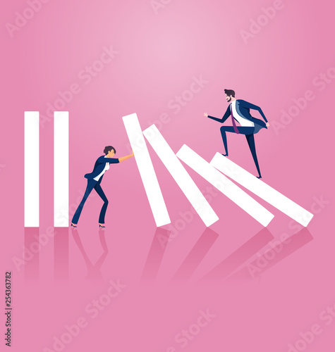 Businesswoman trying to stop domino effect