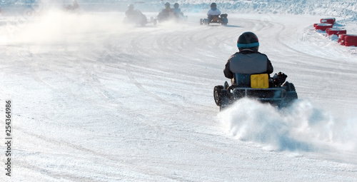 Winter track.Karting in motion in the fog of snow dust.