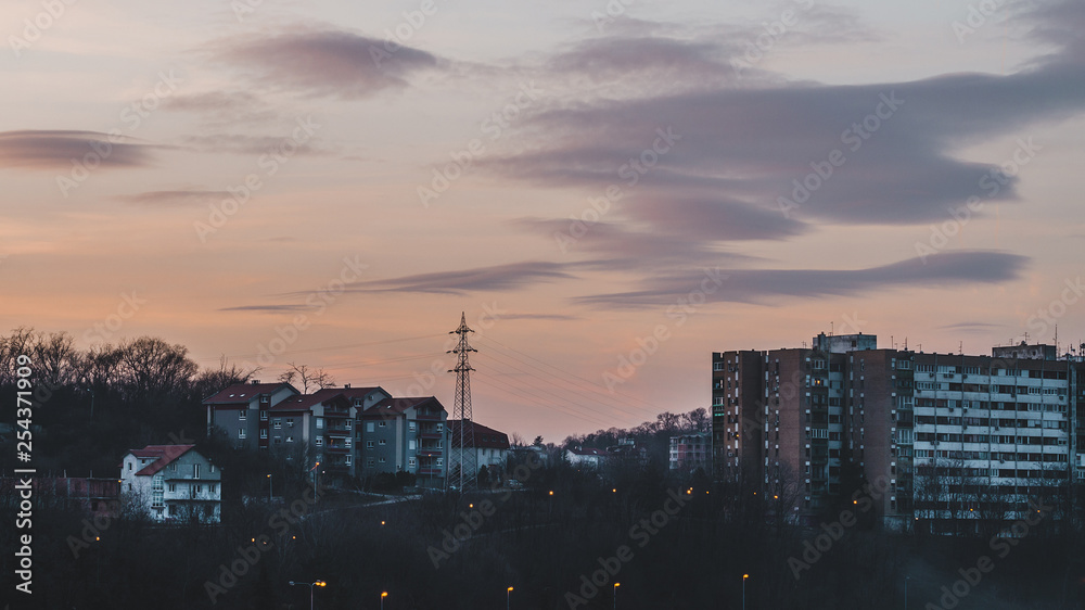 Fototapeta premium Sunset sky above the city buildings