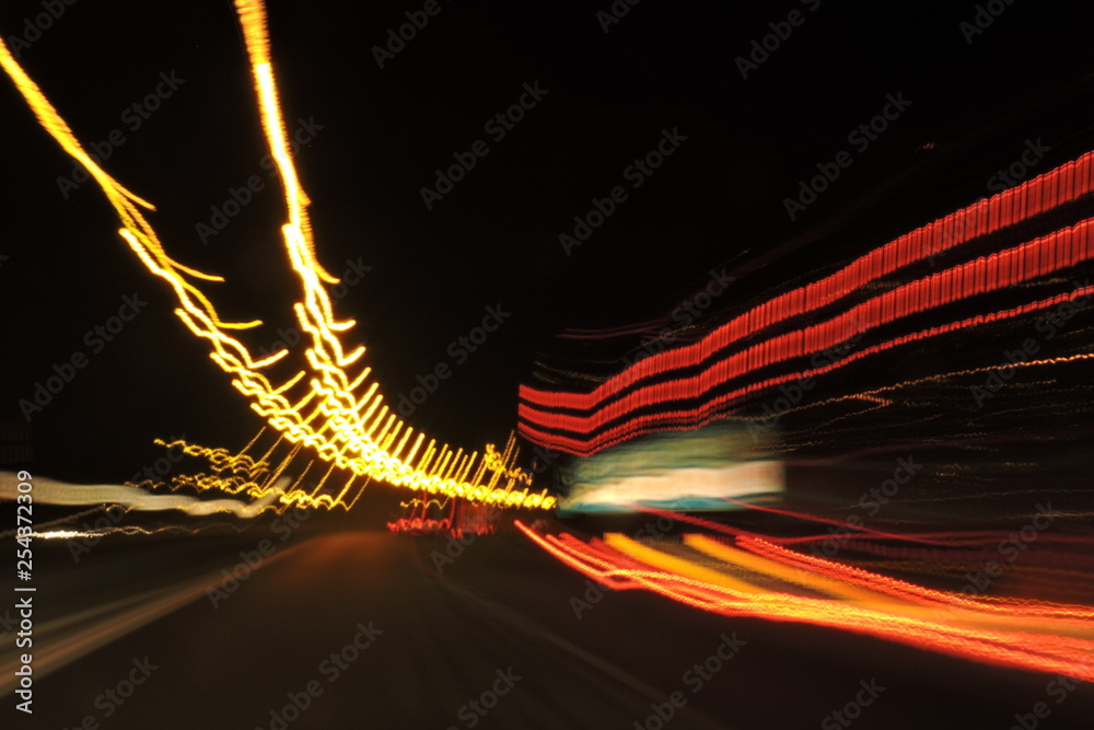 Highway seen at night, blurred street lamp lights, car lights, lines Stock  Illustration | Adobe Stock