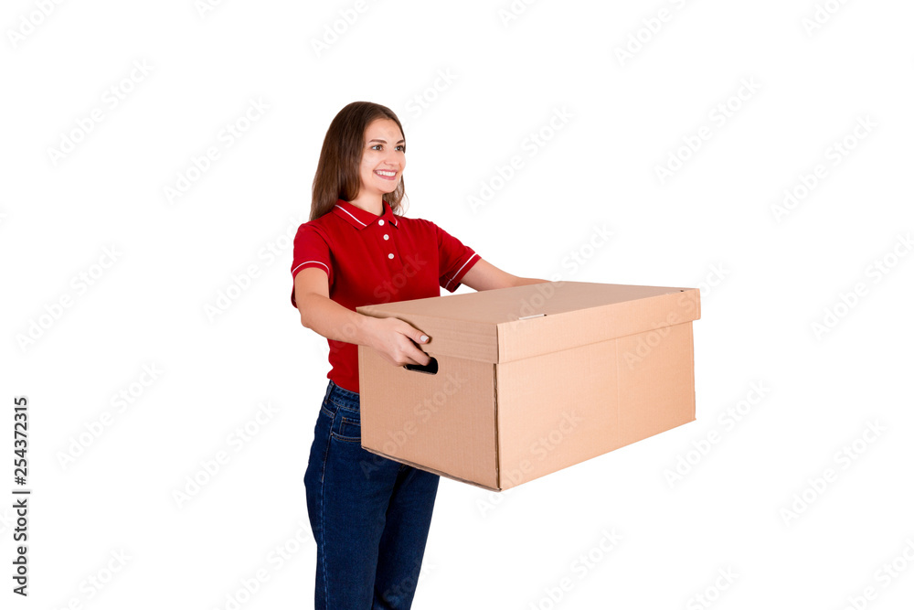 Smiling young female courier is giving a parcel box to a client isolated on white background Smiling young female courier is giving a parcel box to a client isolated on white background