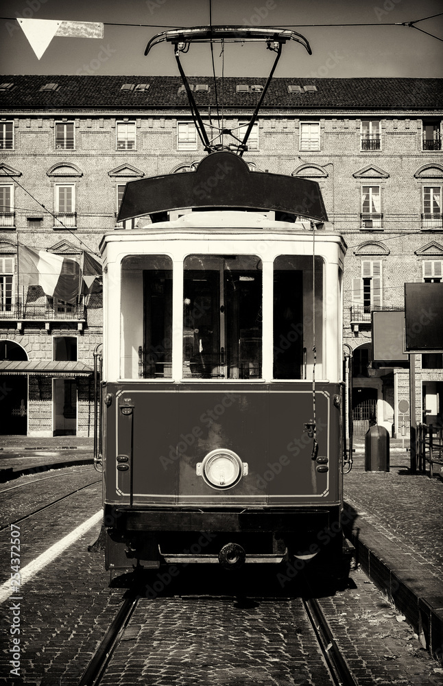 Vintage looking photo of the historical tramway line  stops in Piazza Castello, main square of Turin (Italy)