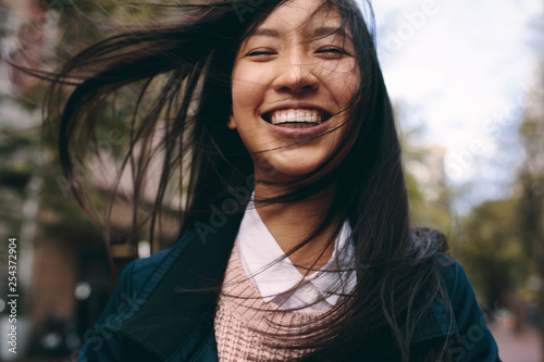 Close up of a smiling asian woman photo