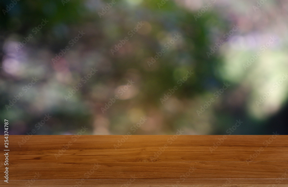 Empty wooden table in front of abstract blurred green of garden and nature light background. For montage product display or design key visual layout - Image Empty wooden table in front of abstract blurred green of garden and nature light background. For montage product display or design key visual layout - Image