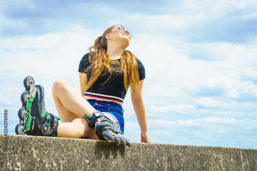 Fit girl with roller skates outdoor Fit girl with roller skates outdoor