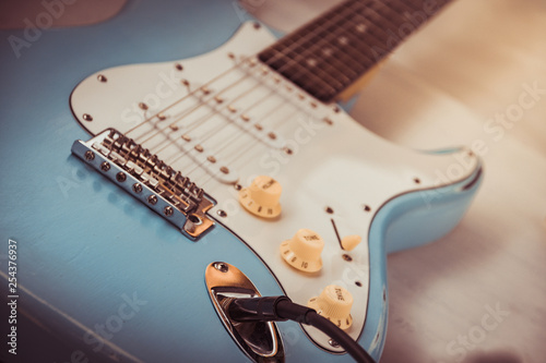 Details and connection of guitar and wire cable jack. Tone and volume controls