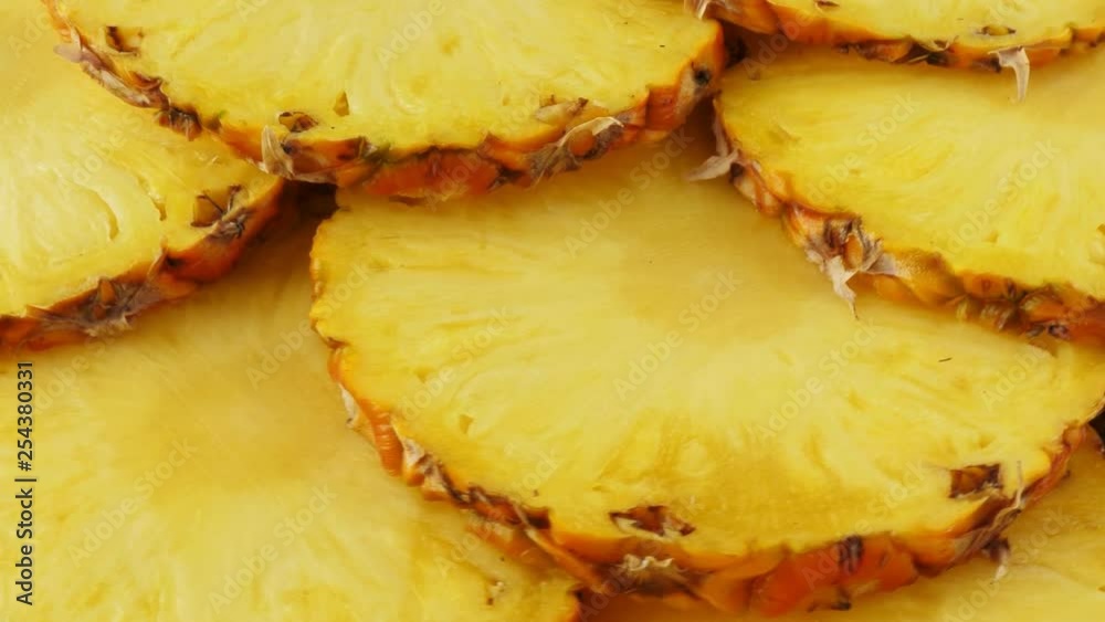 Sliced pieces of delicious pineapple fruit. Tropical summer food. Rotate Sliced pieces of delicious pineapple fruit. Tropical summer food. Rotate