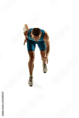 Young caucasian man running isolated on white studio background. One male runner or jogger. Silhouette of jogging athlete with shadows.