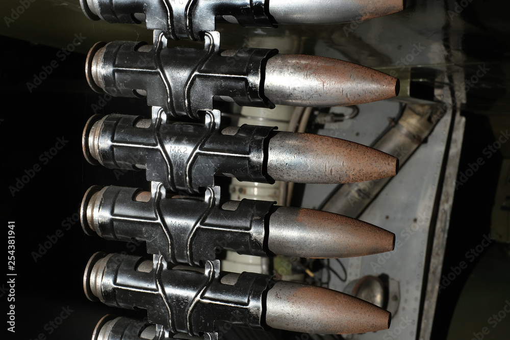Belt of 30 mm cannon shells in links to load into aircraft weapons.