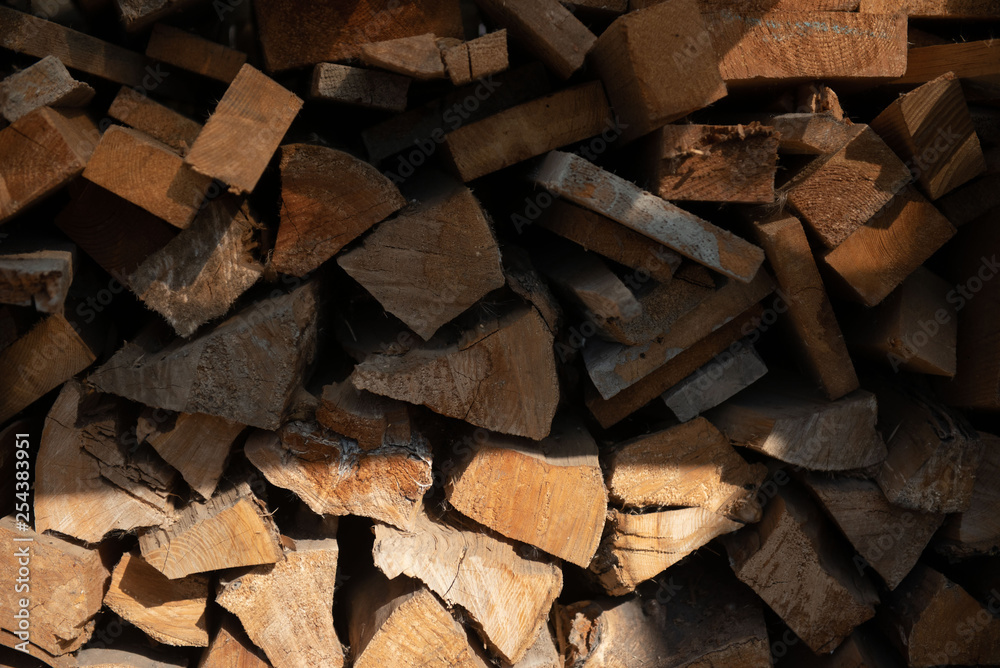 Wooden chopped firewood lies in a pile Wooden chopped firewood lies in a pile