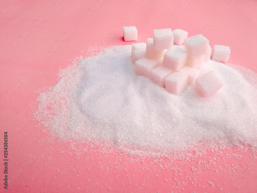 Fototapeta premium white sugar on the pink table with sugar spread .