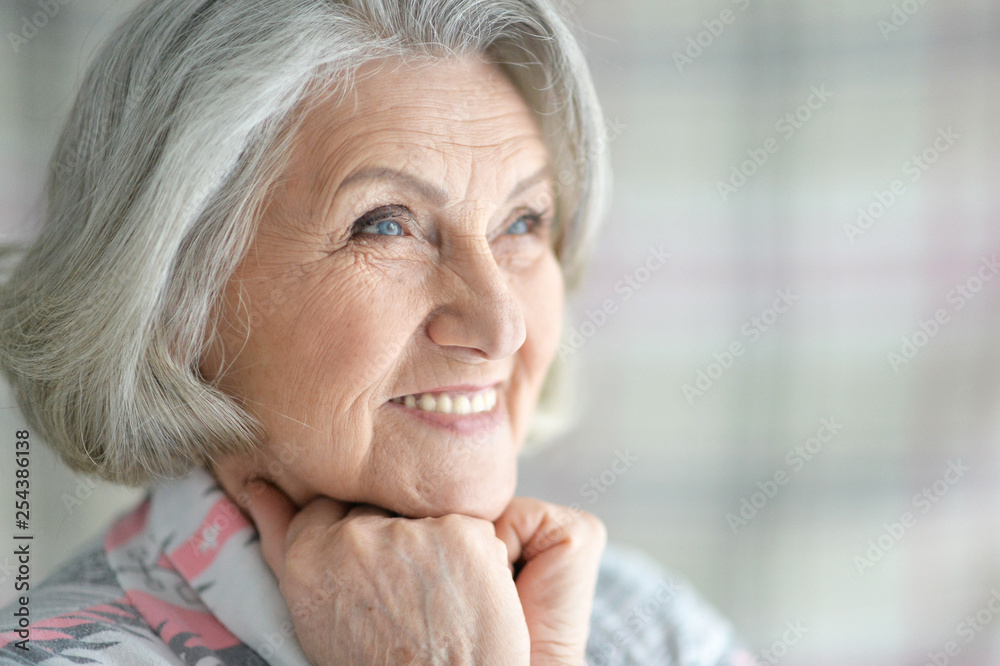 Portrait of happy senior woman posing at home Portrait of happy senior woman posing at home