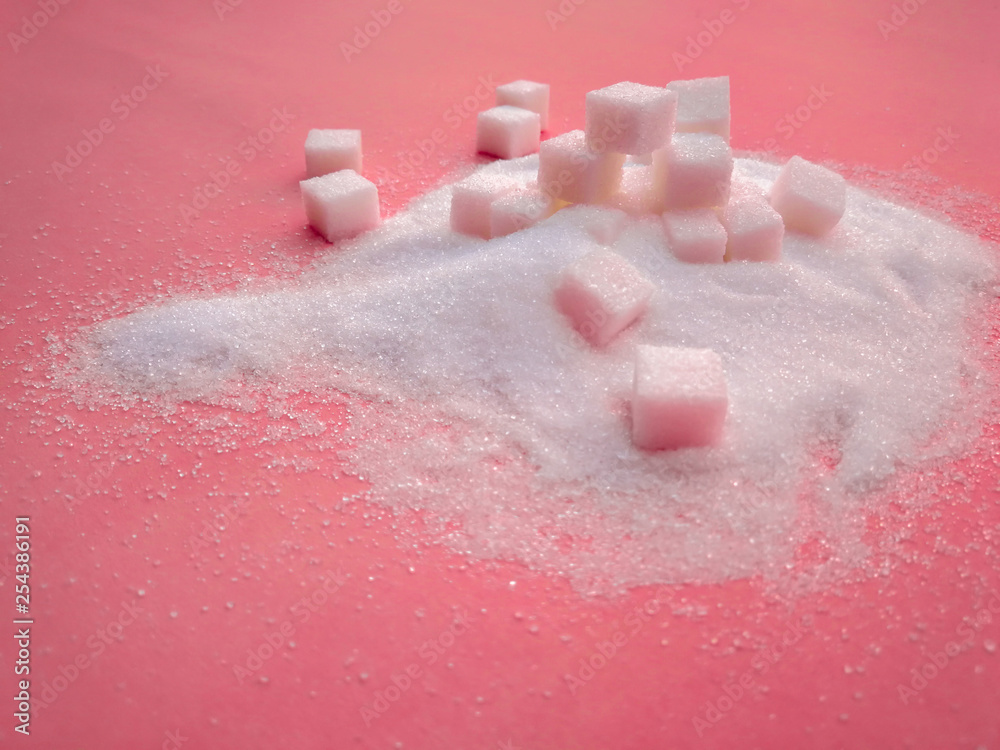 Fototapeta premium white sugar on the pink table with sugar spread .