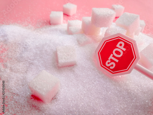 Stop sign on the sugar, warned that the sugar too much will make unhealthy nutrition, obesity, diabetes, dental care and much more. photo