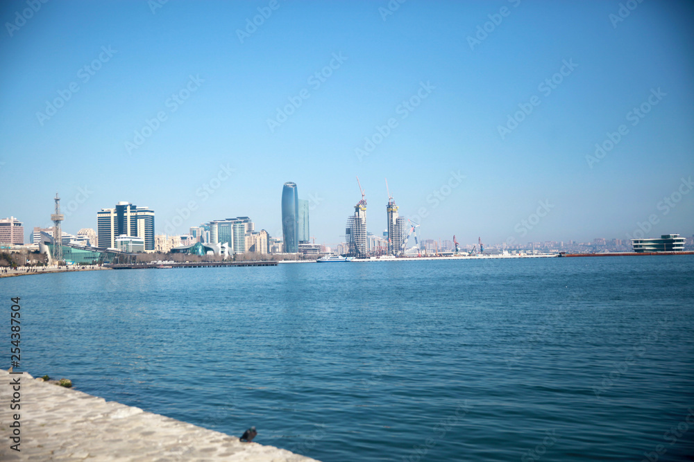 Baku, Azerbaijan - 09.03.2019 Baky skyline view from Baku boulevard the Caspian Sea embankment  Tall buildings in Baku. 