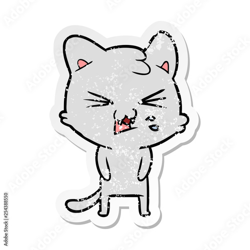 distressed sticker of a cartoon hissing cat