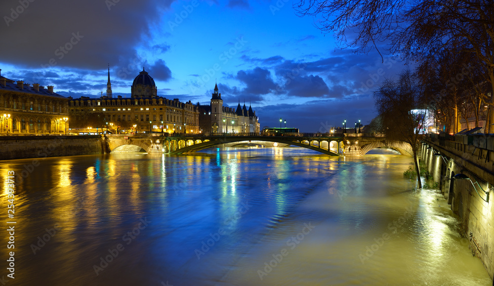Paris by night. Night view of Paris flood as river Seine rises and approaches record level. January 2018, view from Hotel de Ville at Ile de la Cite