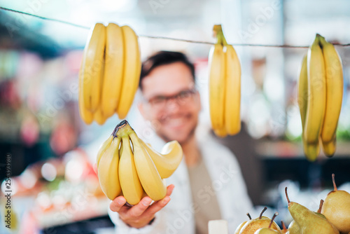 Selling bananas at farmer's market.