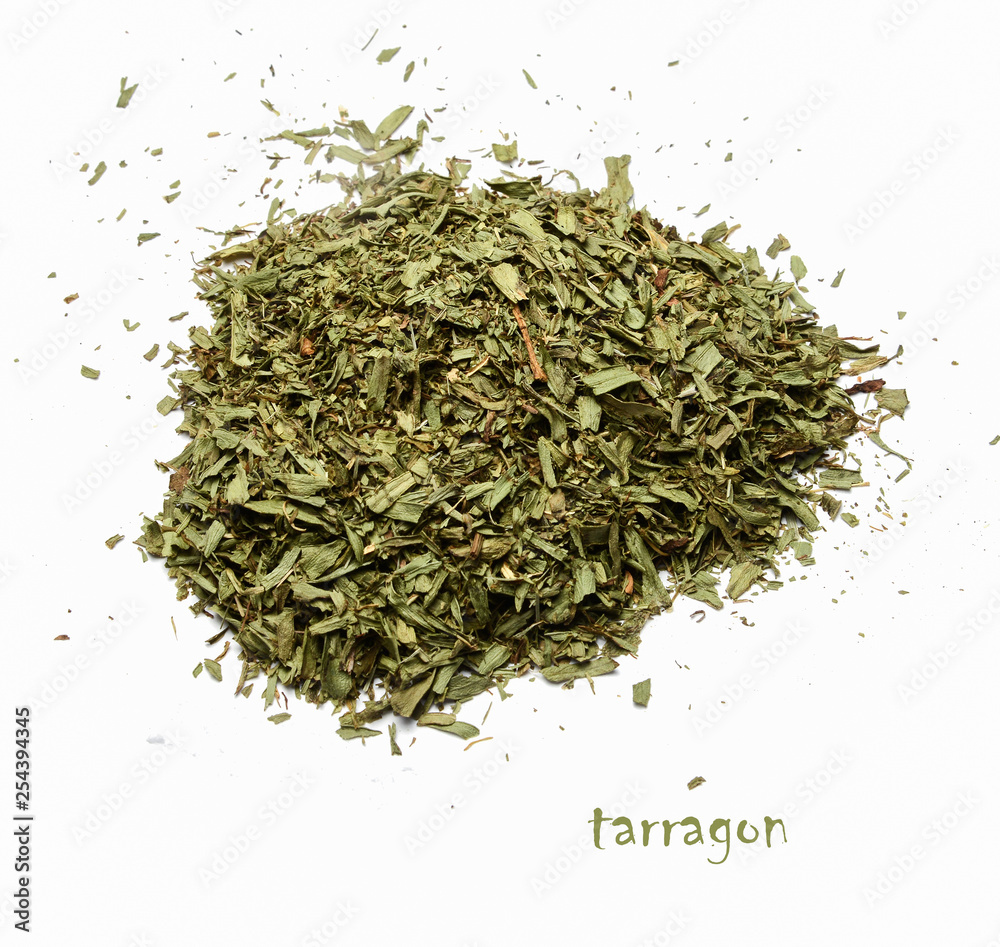 A pile of dried chopped tarragon on a white isolated background. View from above. A pile of dried chopped tarragon on a white isolated background. View from above.