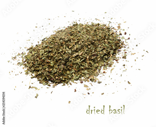 A handful of dried basil on a white isolated background. View from above.