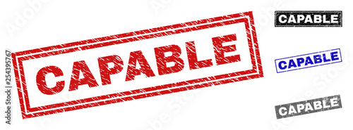 Grunge CAPABLE rectangle stamp seals isolated on a white background. Rectangular seals with grunge texture in red, blue, black and grey colors.