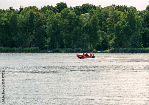 rescue service in the motorboat on the lake