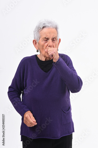 senior woman with cough on white background
