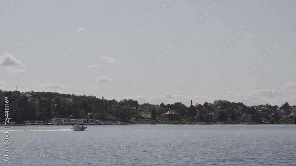 Boat with motor rides on the lake.