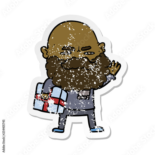 distressed sticker of a cartoon man with beard frowning with xmas gift