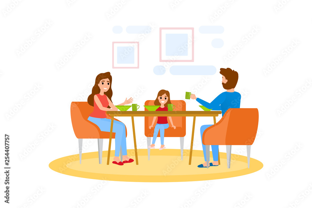 Family having breakfast at the kitchen table Family having breakfast at the kitchen table