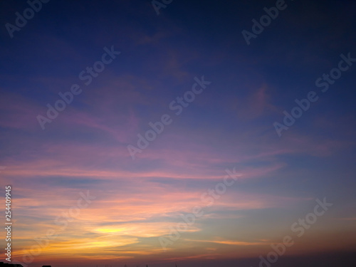 Fiery sunset sky with Cloud density. night sky . © Nitiphonphat