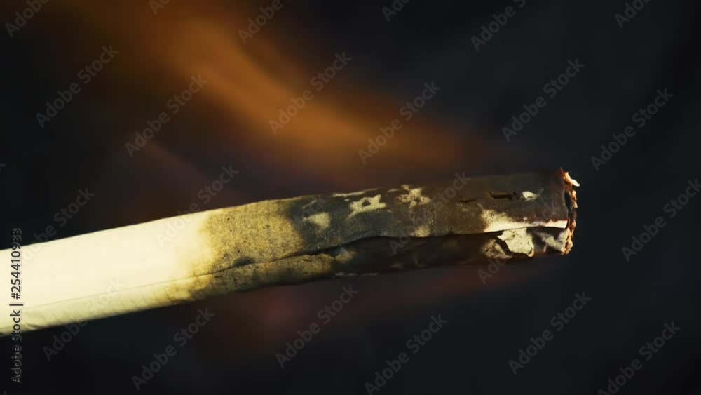 Abstract concept of the dangers of Smoking. Cigarette on fire. Abstract concept of the dangers of Smoking. Cigarette on fire.