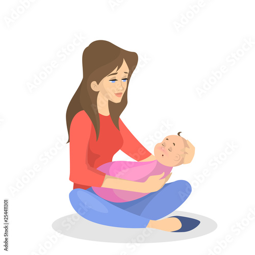 Young mother holding a sleeping newborn child
