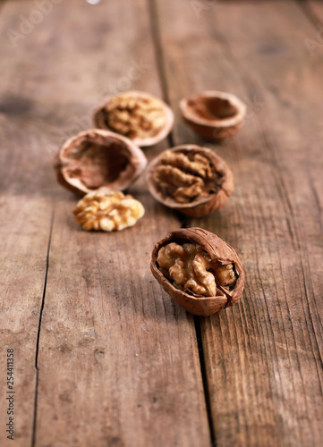 walnuts on a rustic wooden table - close up