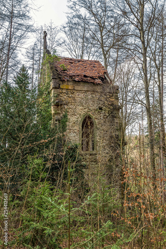 small abandoned gothic chapel in the woods © dieterjaeschkephotos