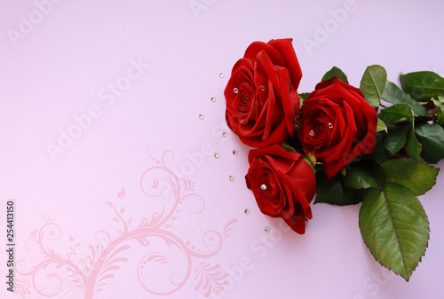 red roses for cards in the background
