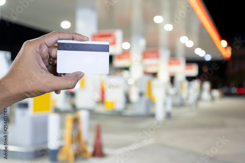 Credit card to make a payment for refueling car on gas station - Image