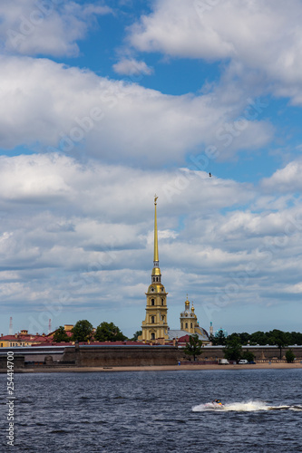 The view from the Neva on the famous Peter and Paul Cathedral and the wall of the Peter and Paul Fortress. St. Petersburg. Russia.