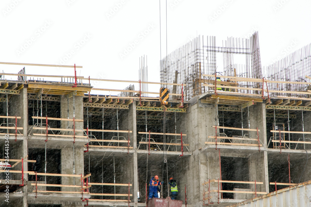 Construction worker on the construction of a modern residential building.