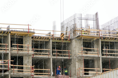 Construction worker on the construction of a modern residential building.