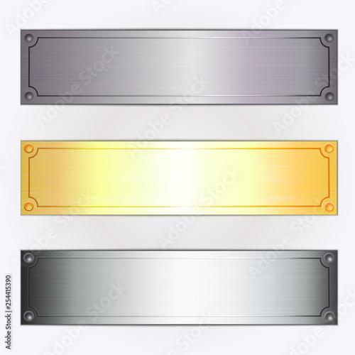 Set of three metallic plates.